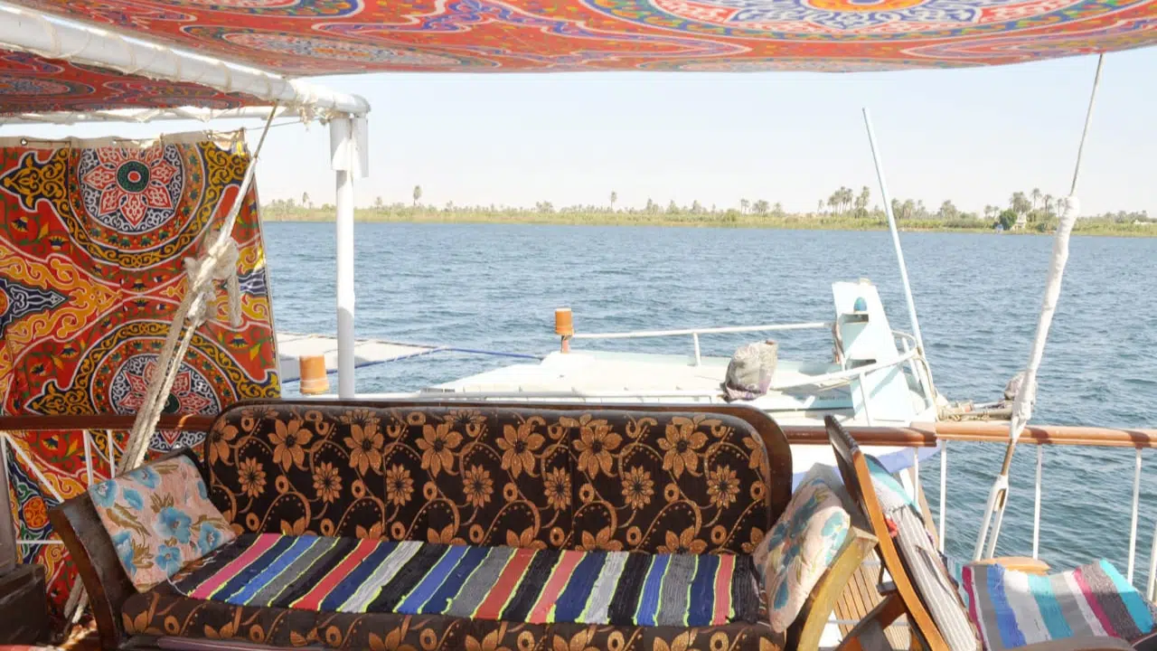 Enjoy the vibrant charm of a traditional dahabiya as you sail the Nile in comfort. This upper deck area is shaded with handcrafted Egyptian textiles, offering a welcoming space for relaxation, dining, and socializing. Surrounded by the flowing river and authentic decor, this floating lounge brings together the best of cultural design and slow travel luxury. Ideal for eco-tourism, group retreats, or a romantic cruise between Luxor and Aswan.