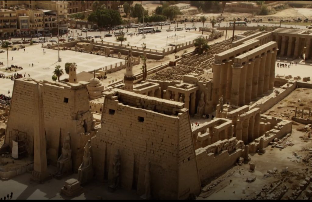 Aerial view of Luxor Temple with ancient statues and surrounding city in Luxor Egypt
