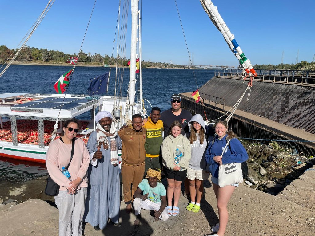Family from New Zealand with the crew of felucca Maitea during a Nile sailing trip near Aswan Egypt