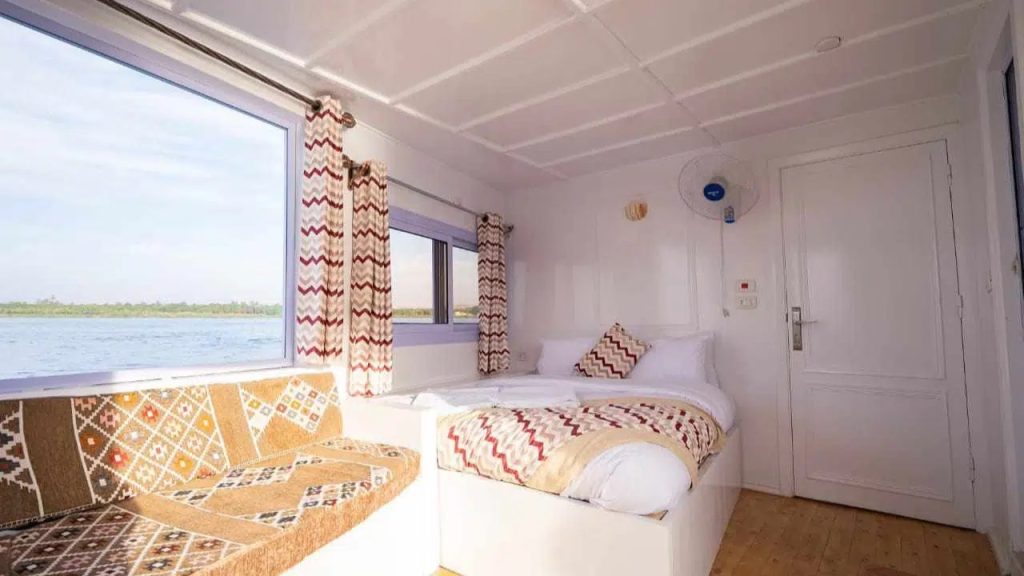 Private cabin on Nunet dahabiya with Nile river view in Egypt