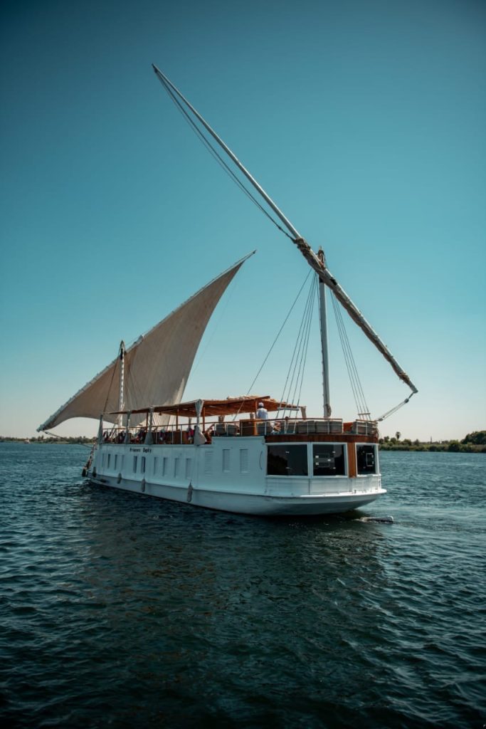 Princess Kelly dahabiya sailing on the Nile during Serket tour in Egypt with full sails