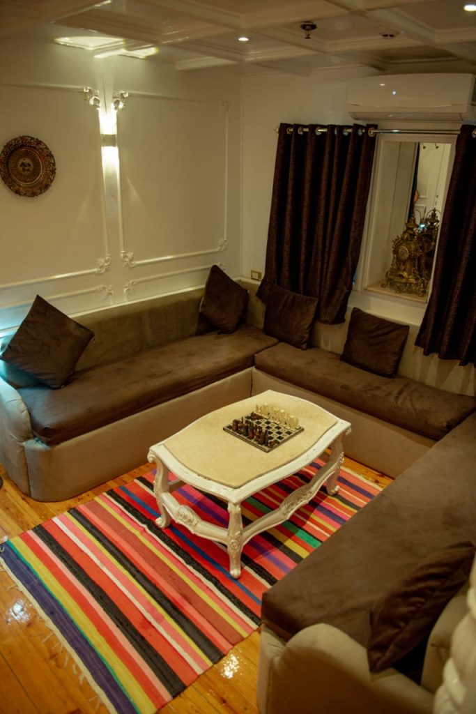 Indoor lounge seating area on Princess Kelly dahabiya during Serket tour in Egypt